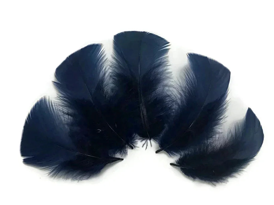 Deep navy blue decorative feathers for DIY crafts and fashion accessories on a white background.