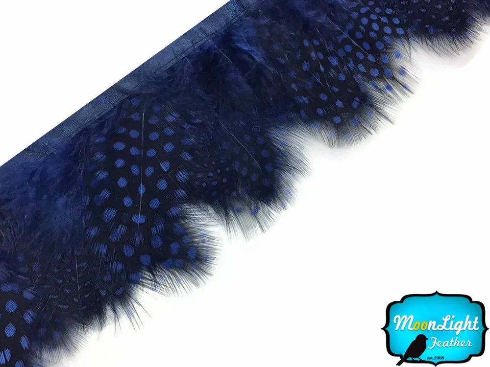 Deep blue patterned feathers for DIY crafts and fashion accessories.