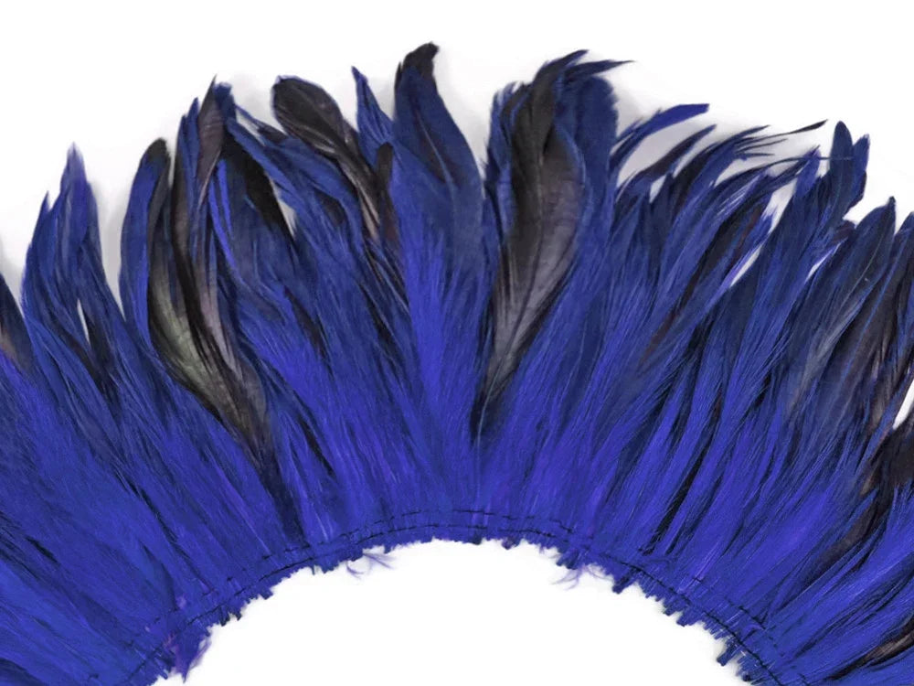Vibrant cobalt blue feathers arranged in a decorative fan shape for crafts and fashion.