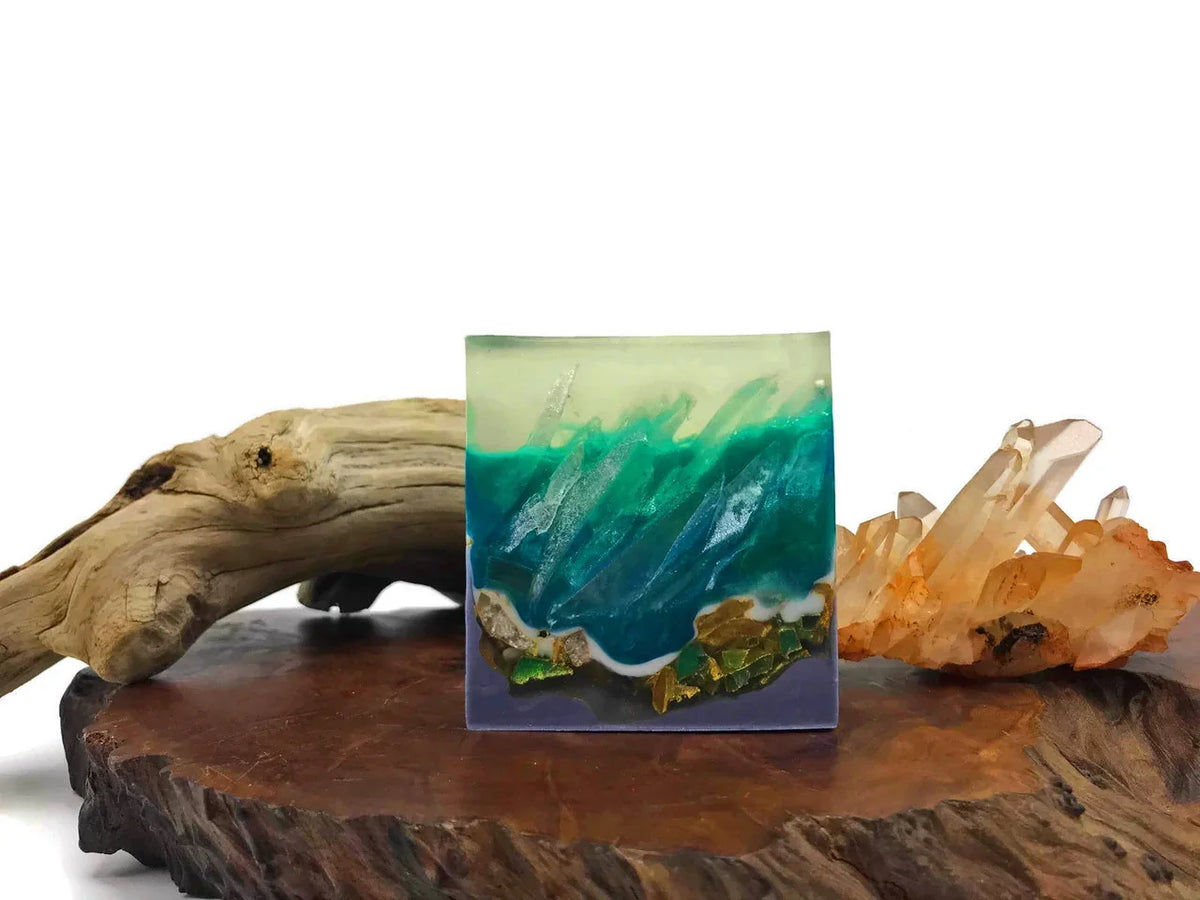 Ocean wave resin art decor with turquoise and gold leaf accents on a wooden base.