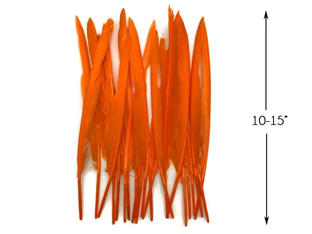 Vibrant orange craft feathers, 10-15 inches long, for DIY fashion and décor projects.