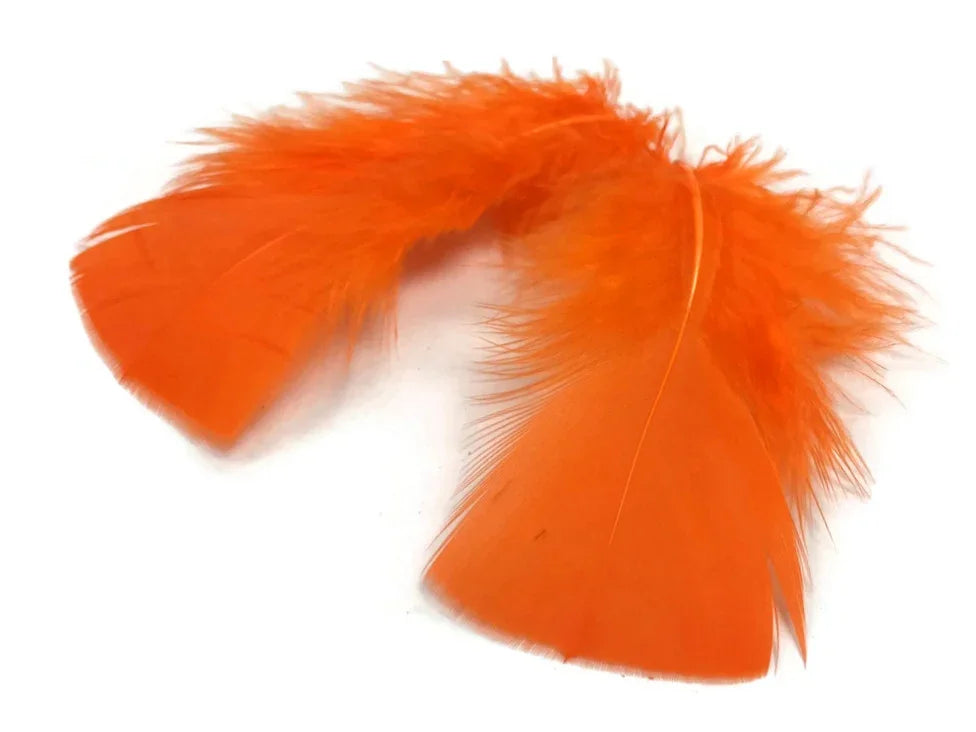 Vibrant orange craft feathers for DIY fashion and decor projects.