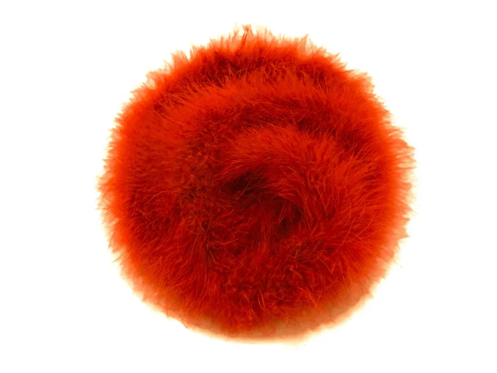 Vibrant red fluffy feather pompom for DIY crafts and fashion accessories.
