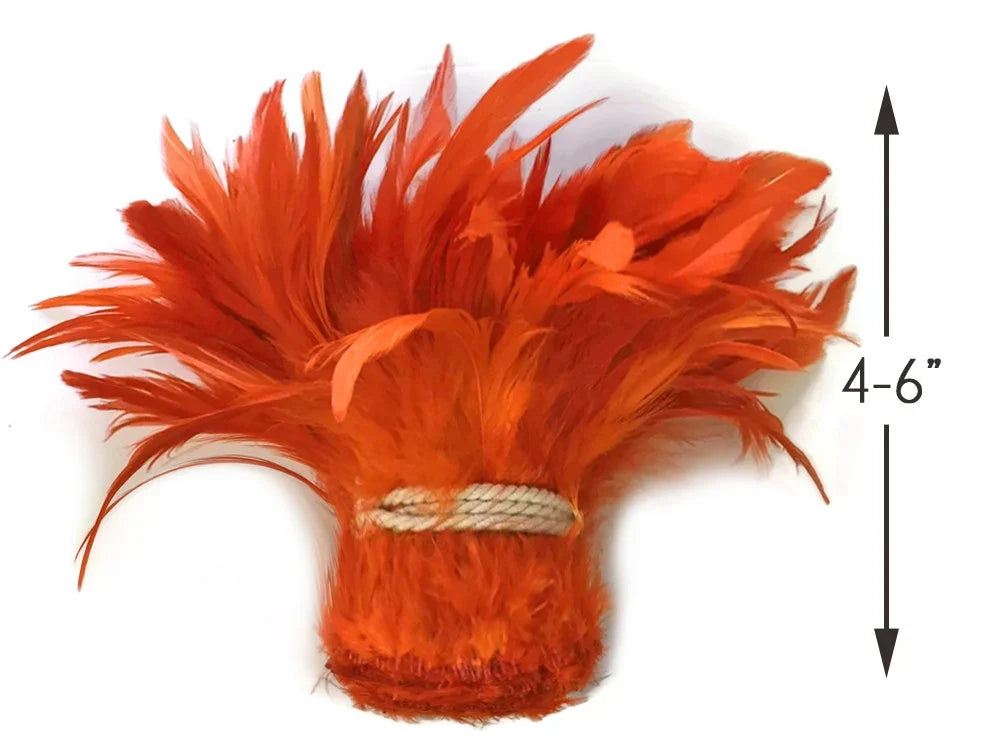Bright orange feather plume, 4-6 inches, for DIY crafts and fashion décor.