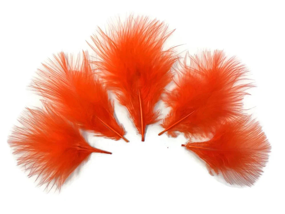 Vibrant orange craft feathers for DIY fashion and decor supplies.