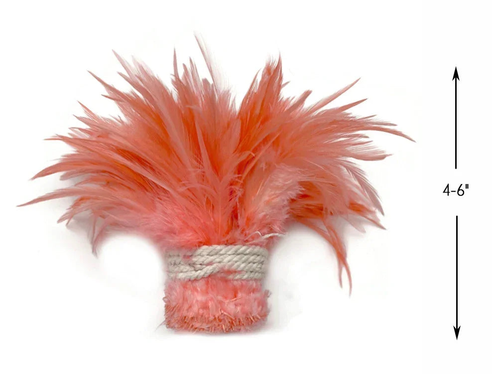 Coral pink feather plume accessory for crafts and fashion decor, 4-6 inches long.