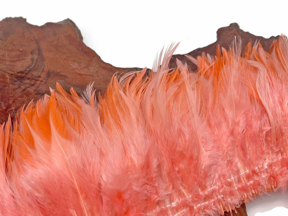 4 Inch Strip – 4-6” Dyed Pink Blush Strung Chinese Rooster Saddle Feathers