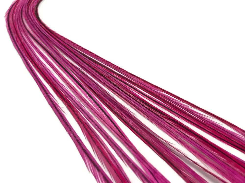 Vibrant magenta pink craft feathers for DIY fashion and decor accessories.