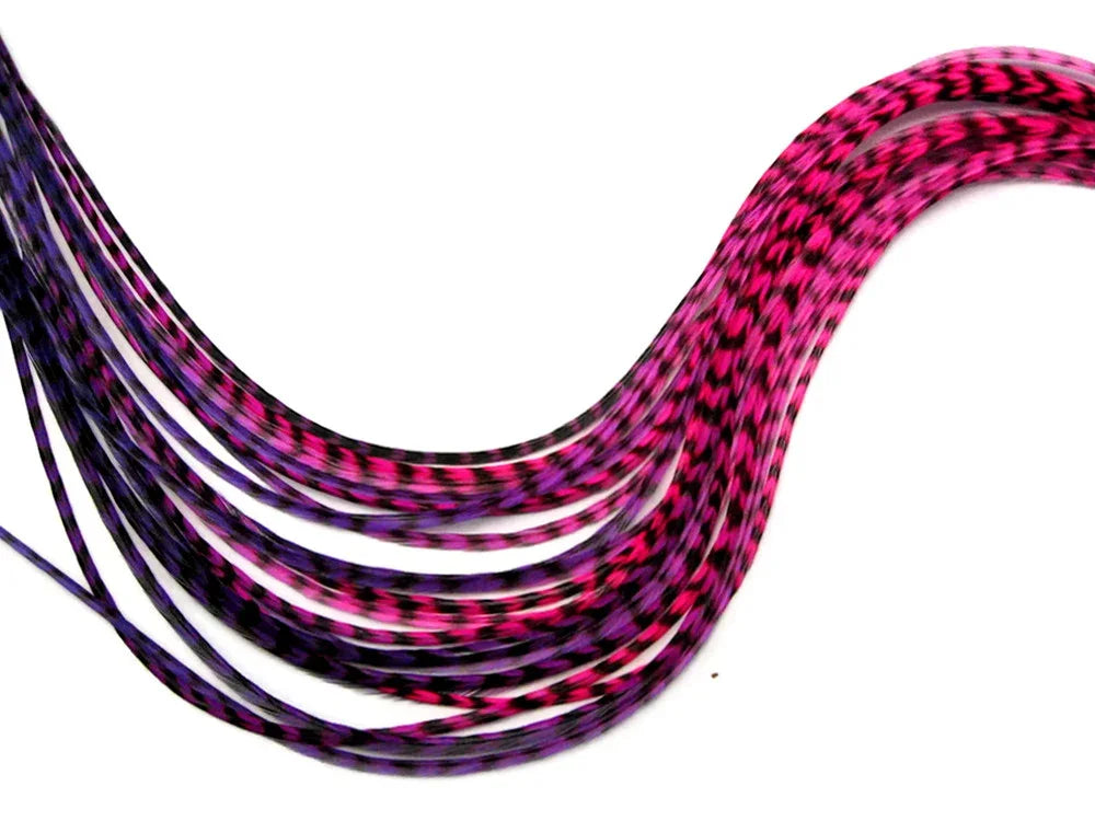 Vibrant pink and purple patterned feather extensions for hair crafts and fashion accessories.