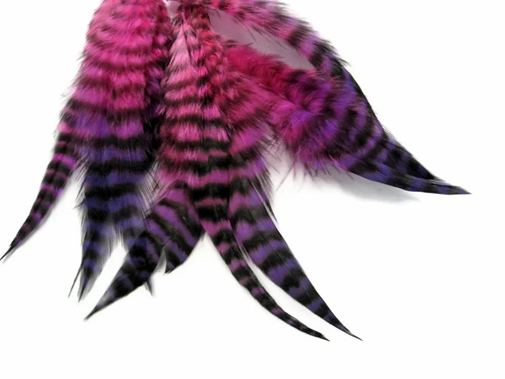 Vibrant pink and purple striped feathers for DIY crafts and fashion accessories.
