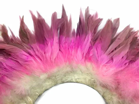 Vibrant pink and mauve dyed feathers for DIY crafts and fashion accessories.