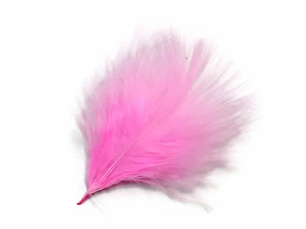 Soft pink fluffy feather for DIY crafts and fashion accessories on a white background.
