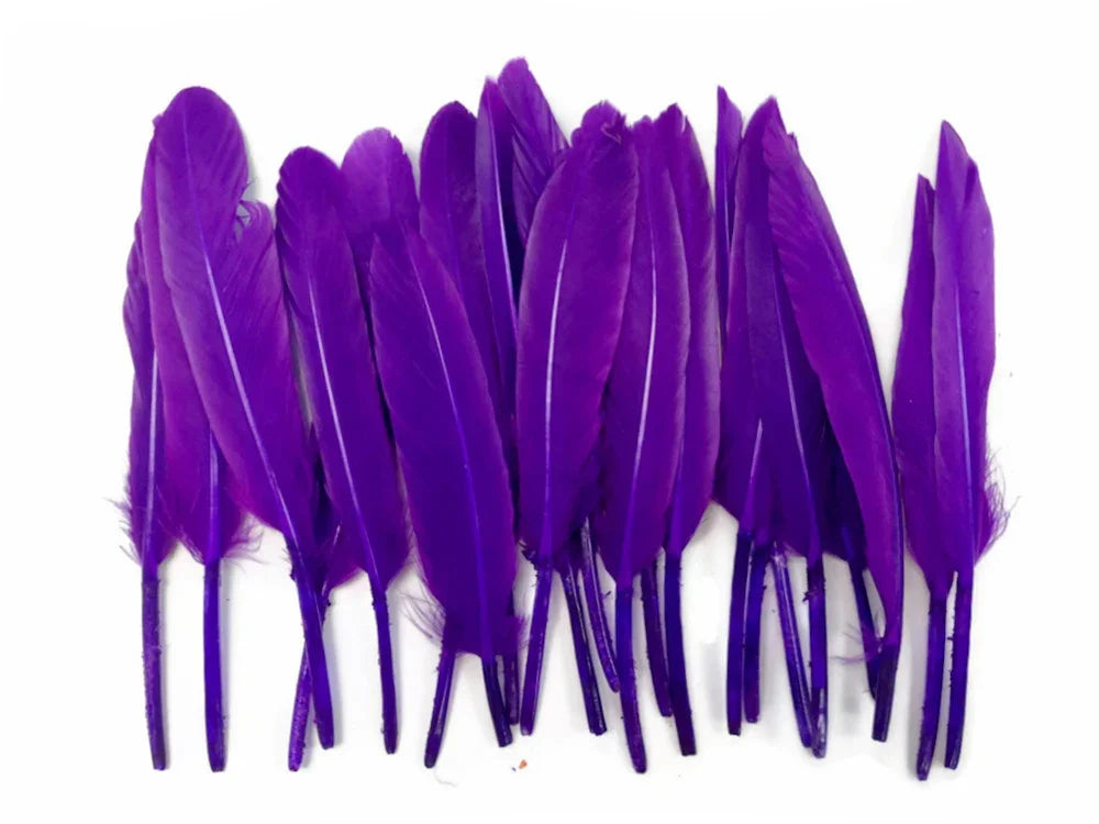 Vibrant purple craft feathers for DIY fashion and costume decor.