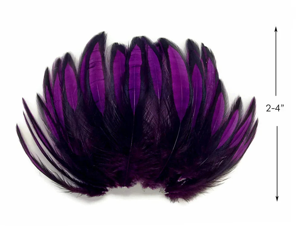 Vibrant purple feathers for crafts and fashion decor, 2-4 inches in length.