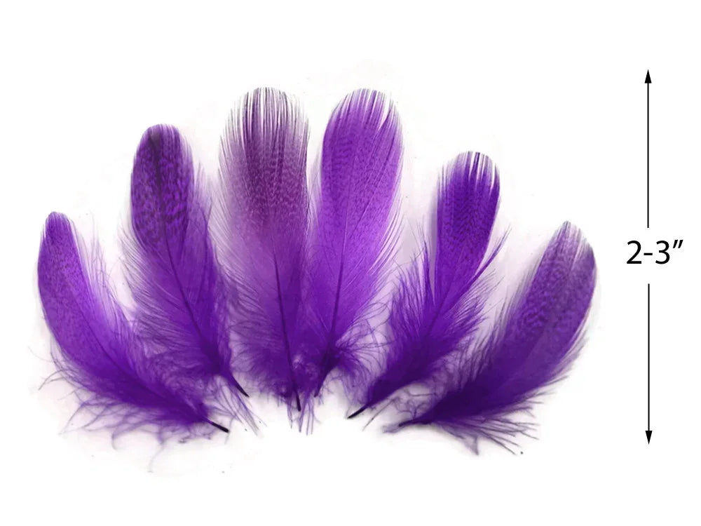 Six vibrant purple craft feathers, 2-3 inches in length, for DIY fashion and decor.