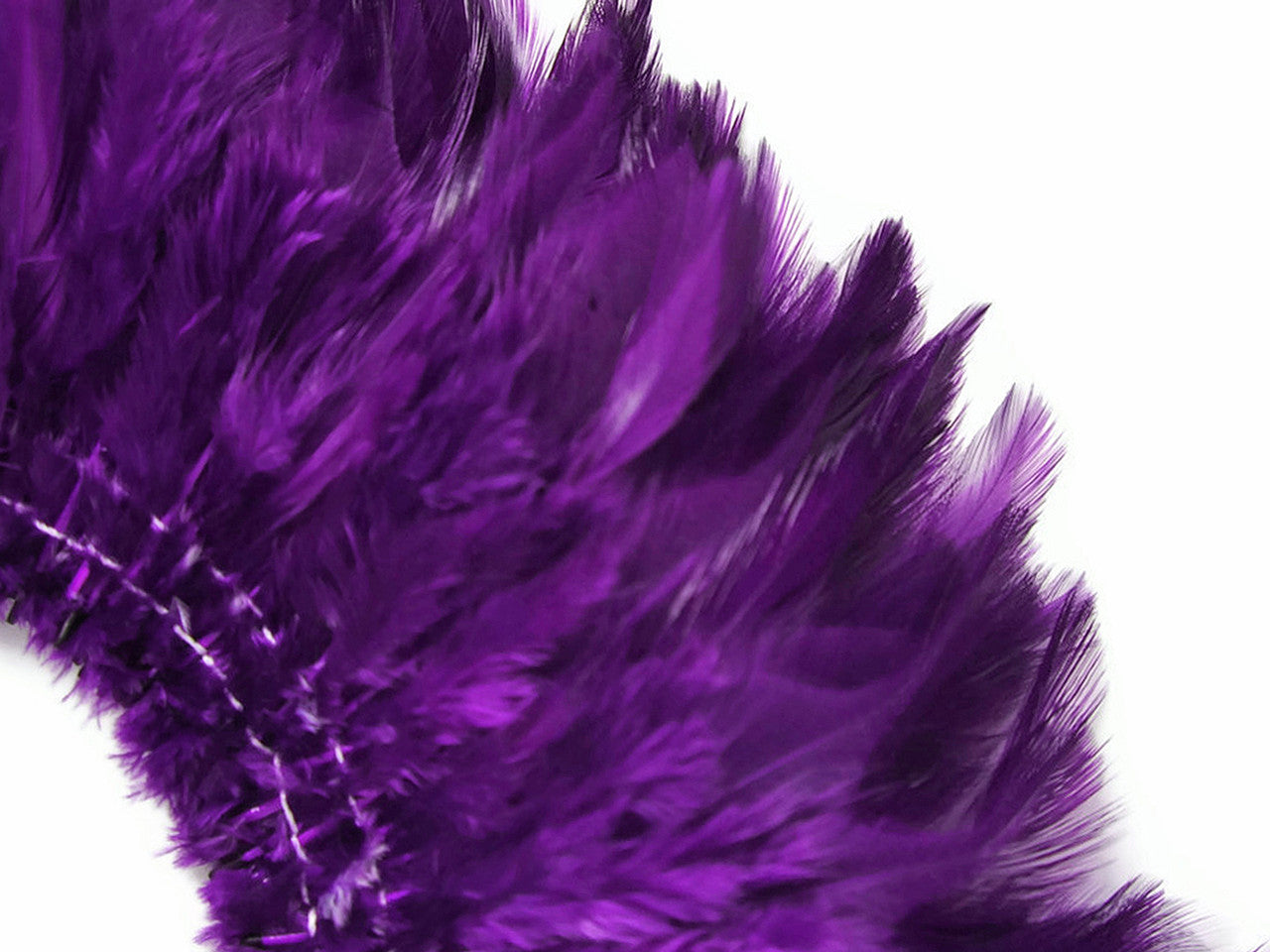 4 Inch Strip – 4-6” Dyed Purple Strung Chinese Rooster Saddle Feathers