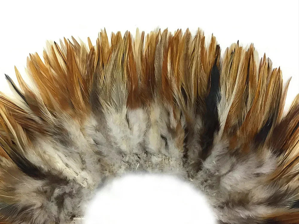 Natural brown and white decorative feathers for DIY crafts and fashion accessories.
