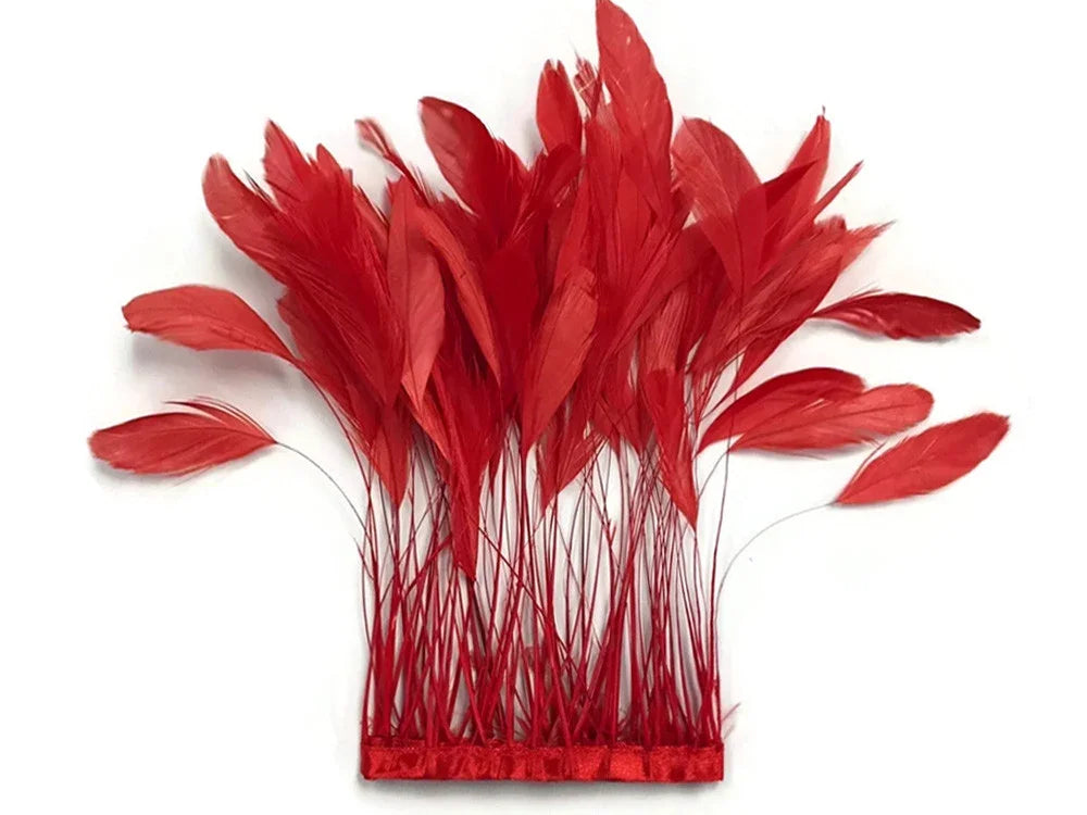 Vibrant red feathers attached to a decorative red ribbon trim for fashion and DIY crafts.