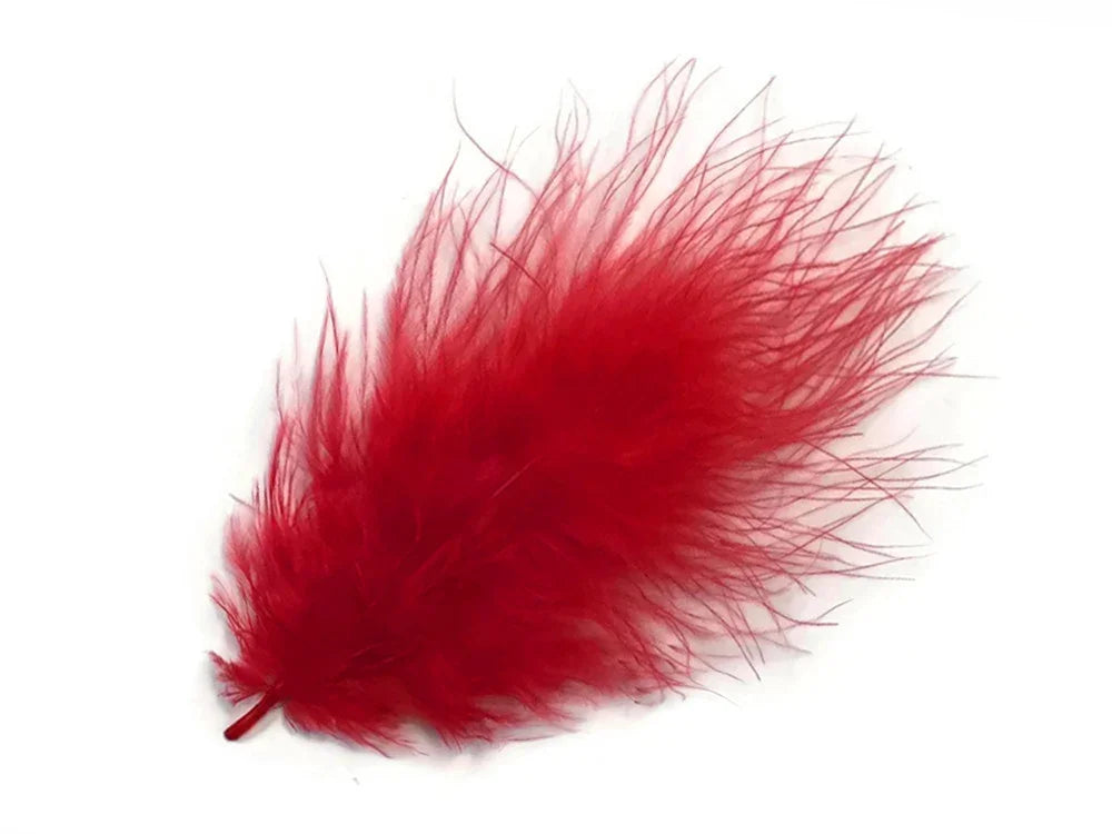 Vibrant red fluffy feather for DIY crafts, fashion accessories, and creative décor.