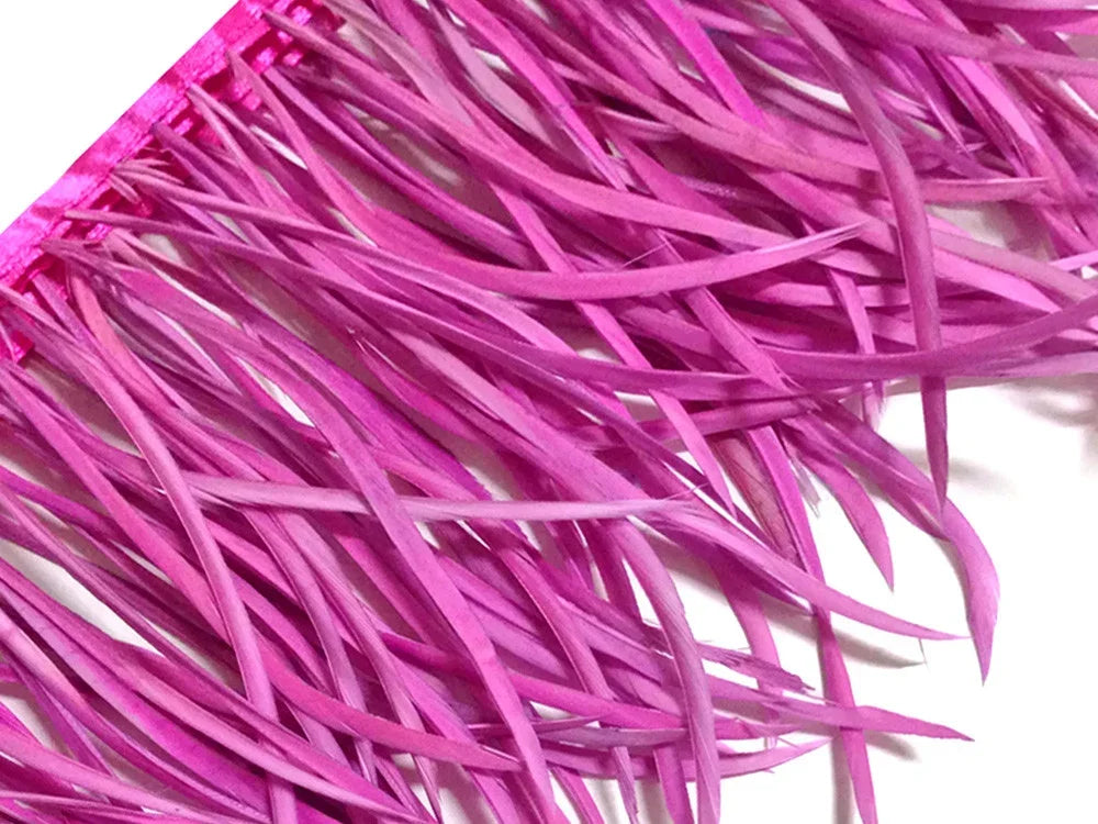 Vibrant pink feather trim fringe for fashion and DIY craft decorations.