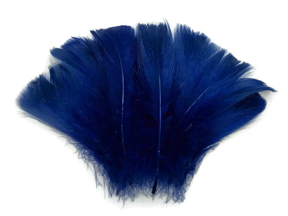 Vibrant royal blue feathers for DIY crafts and fashion accessories on a white background.