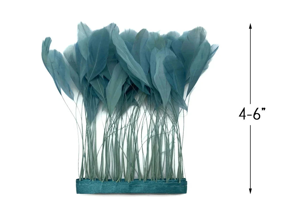 Teal blue decorative feathers for crafts and DIY decor, 4-6 inches in length.