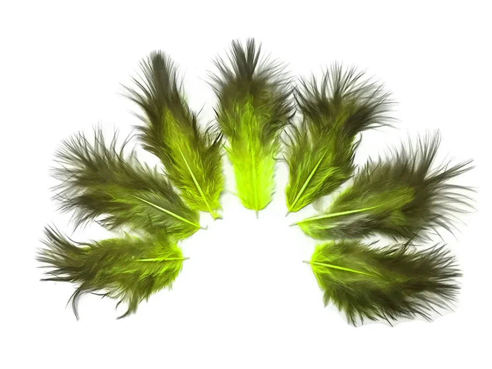 Vibrant lime green and olive dyed craft feathers arranged in a semi-circle on white background.