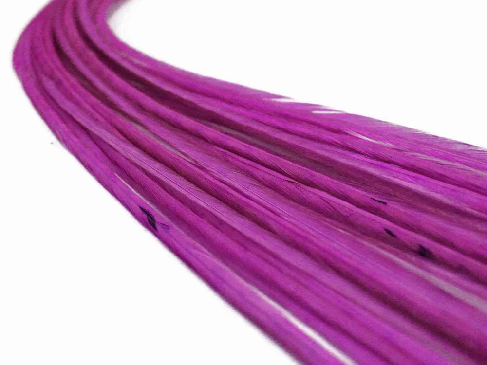 Vibrant magenta pink craft feathers for DIY fashion and décor projects.