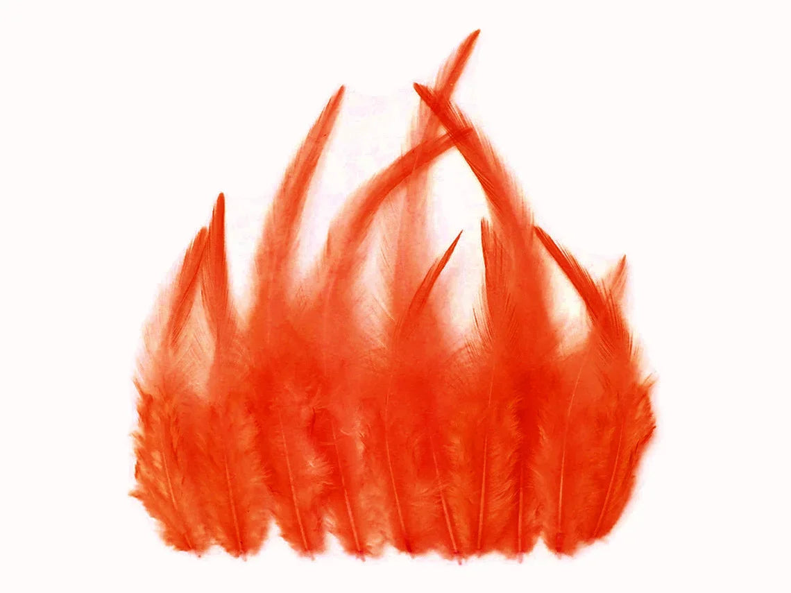 Vibrant orange feathers arranged in a flame-like shape for DIY crafts and fashion decor.
