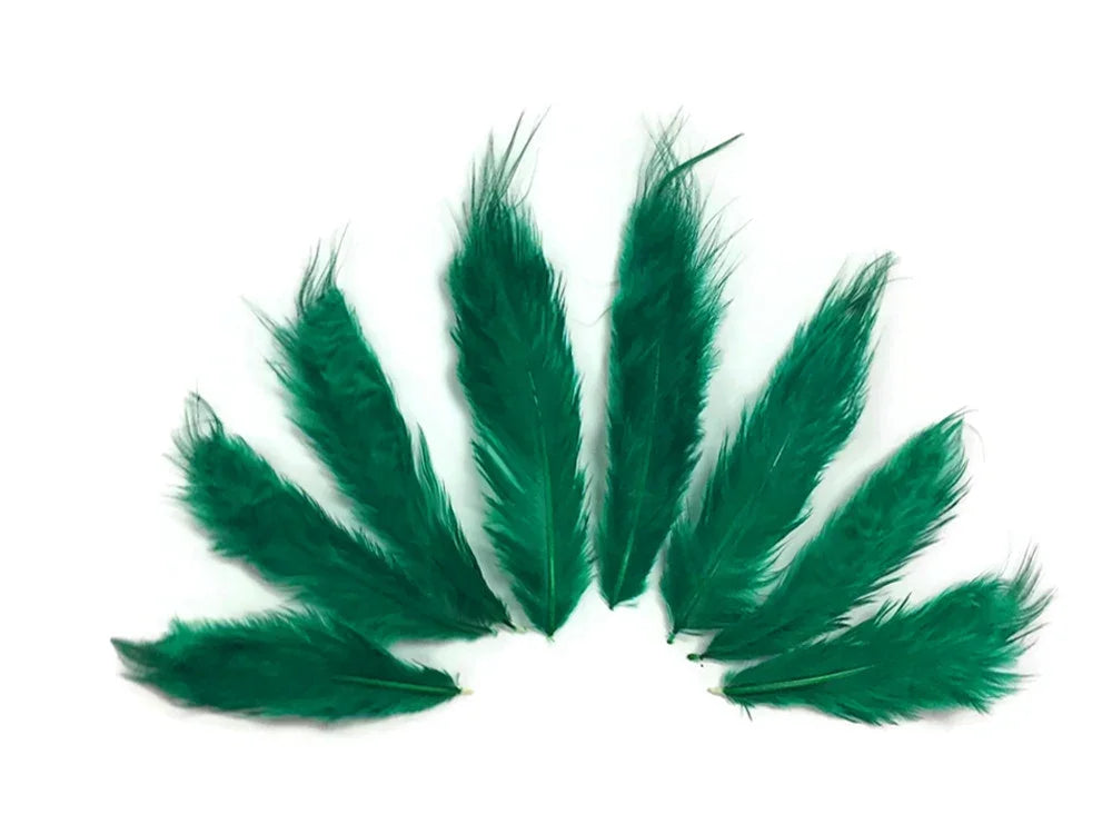 Vibrant emerald green craft feathers arranged in a fan shape on a white background.