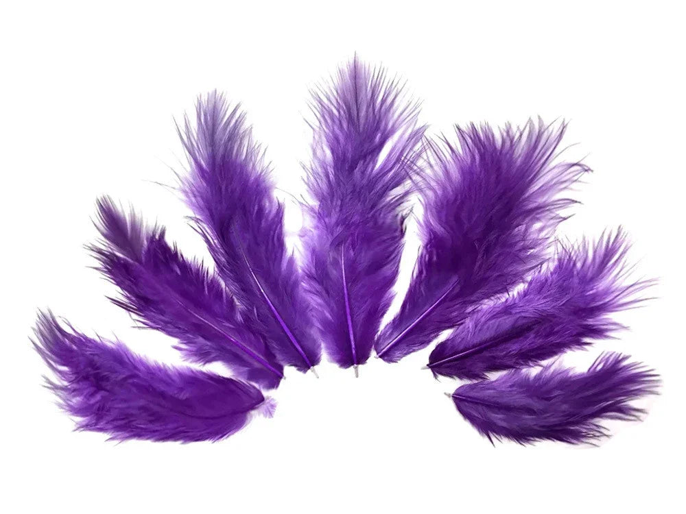 Vibrant purple craft feathers arranged in a fan shape on a white background.