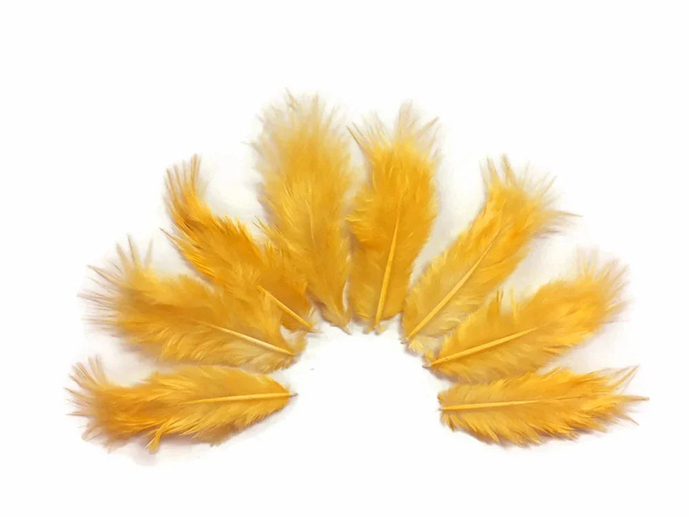 A collection of soft yellow craft feathers arranged in a semi-circle on a white background.