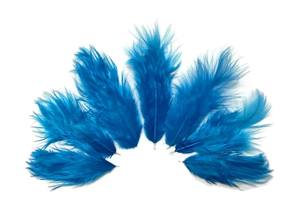 Vibrant bright blue craft feathers arranged in a fan shape on a white background.