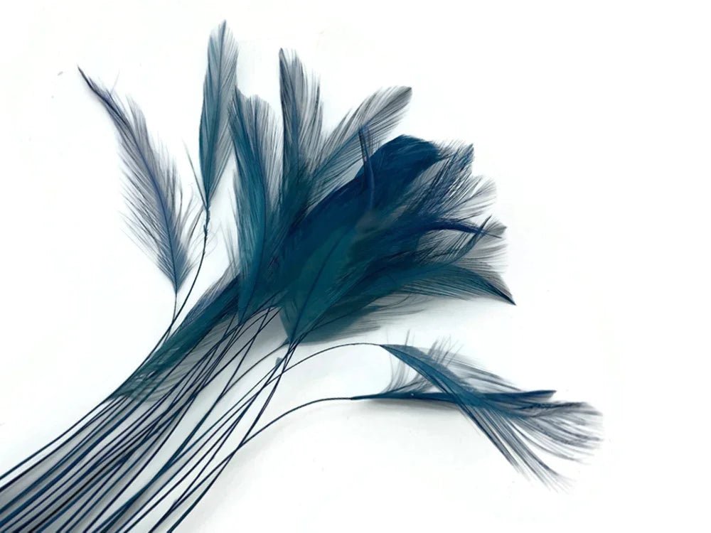 Deep blue dyed feathers for DIY crafts and fashion accessories on a white background