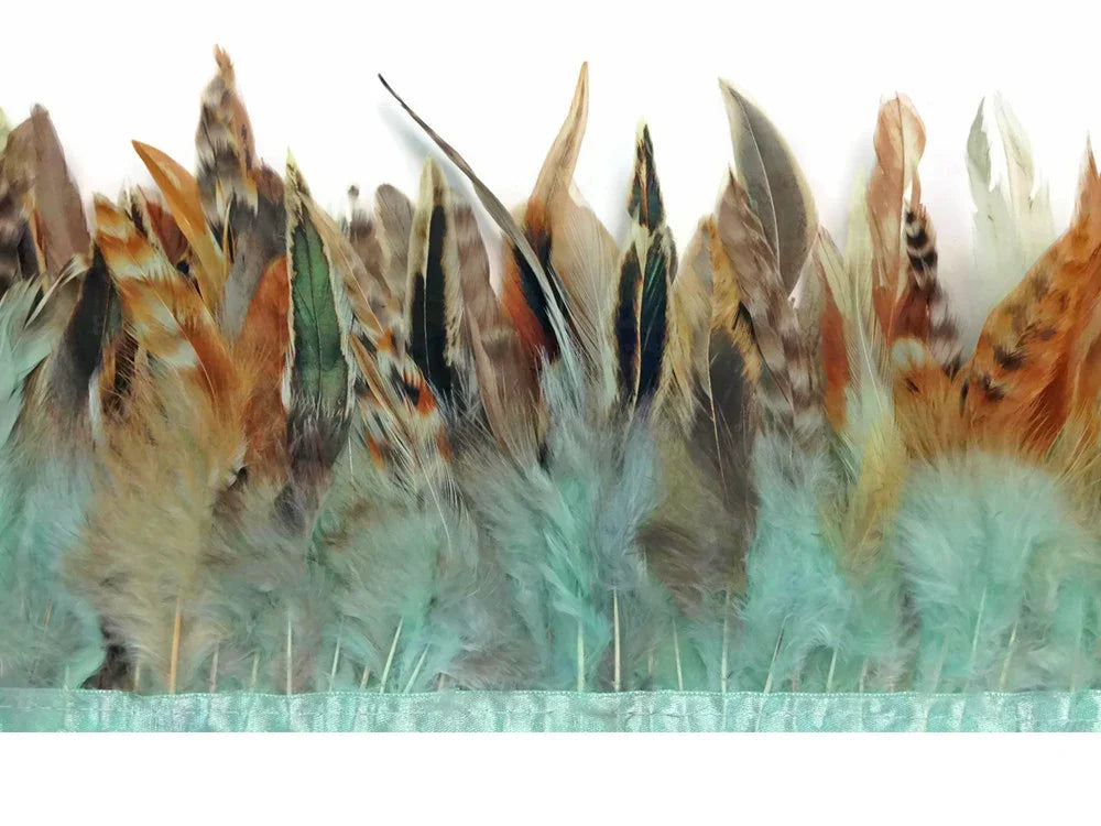 Assorted natural brown and teal dyed craft feathers for DIY fashion and décor.