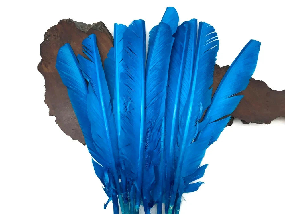 Vibrant bright blue dyed feathers for DIY crafts and fashion accessories.