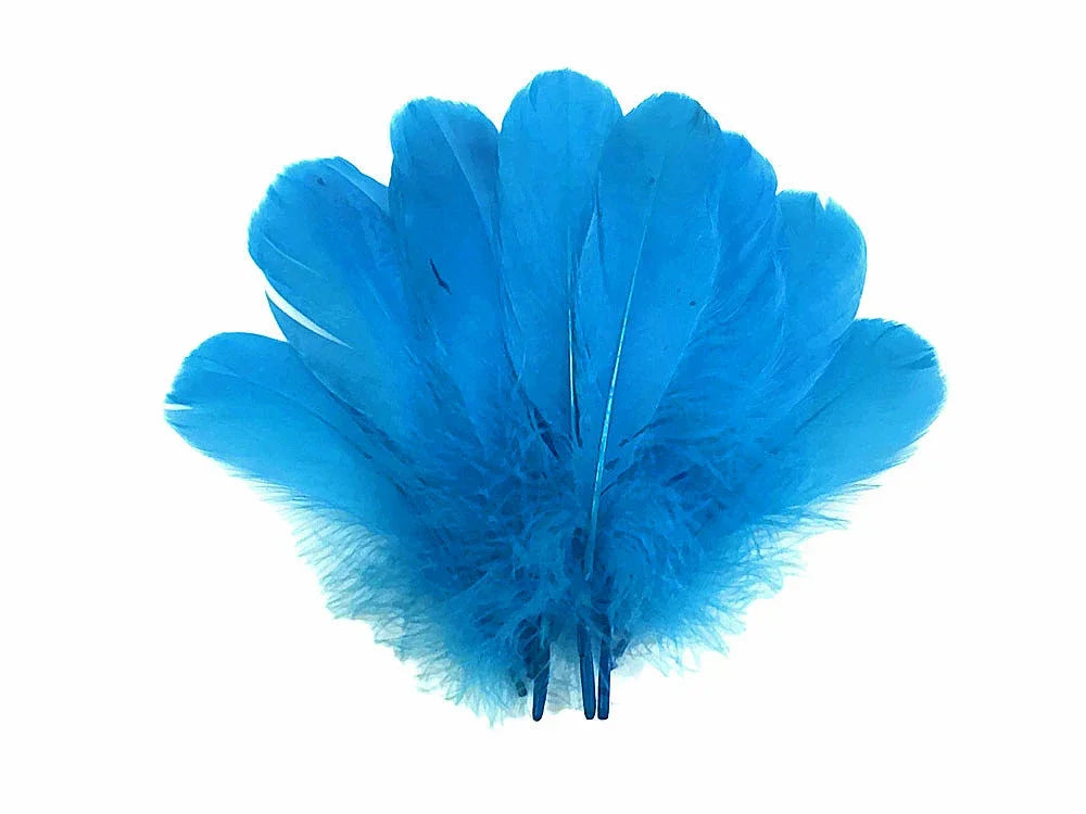 Vibrant bright blue feathers for DIY crafts and fashion accessories on a white background.