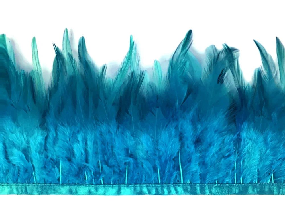 Vibrant teal blue feather trim strip for DIY fashion and craft decorations.