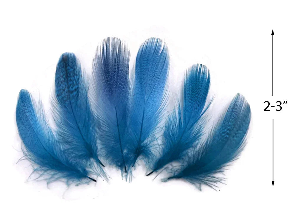 Six vibrant blue craft feathers, 2-3 inches long, for DIY fashion and decor.