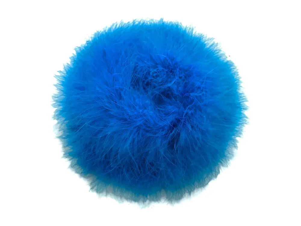 Vibrant bright blue fluffy feather pompom for DIY crafts and fashion accessories.