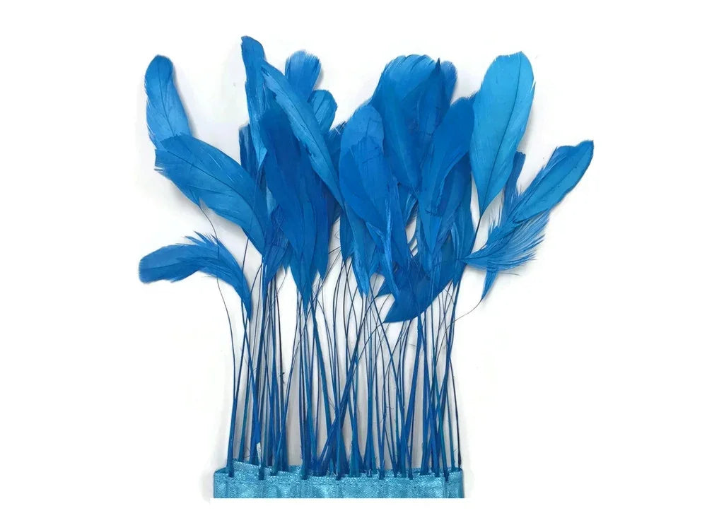 Vibrant blue feathers on stems for DIY crafts, fashion accessories, and decorative DIY supplies.