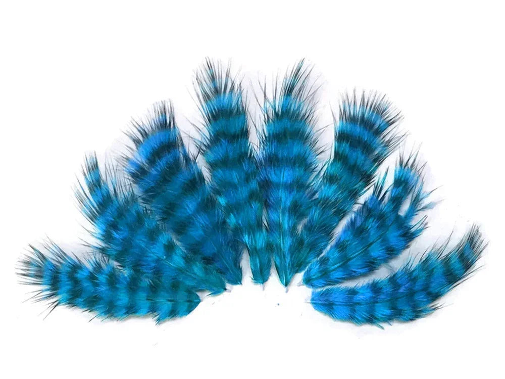Vibrant blue and black striped craft feathers for DIY fashion and decor.