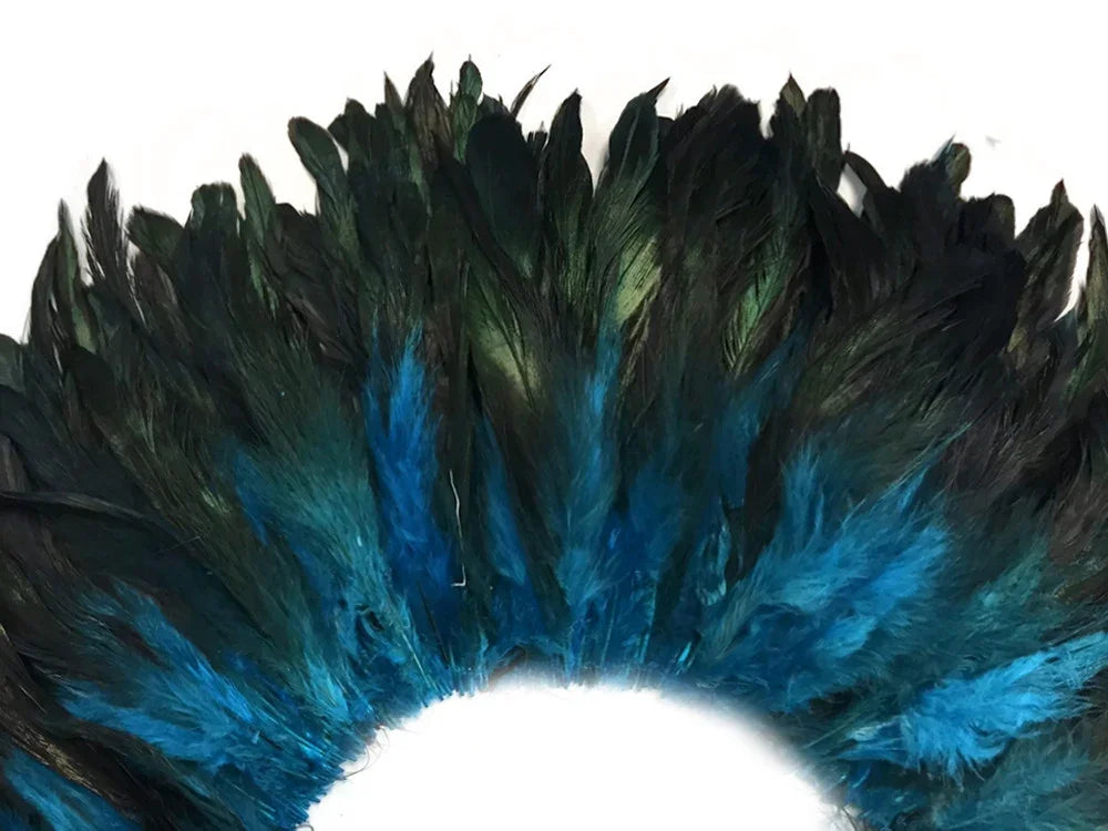 Iridescent blue and dark green feathers for fashion and DIY crafts.