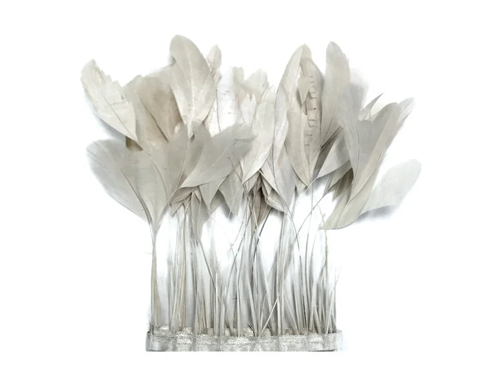 Elegant white decorative feathers in a silver base for DIY crafts and home decor.