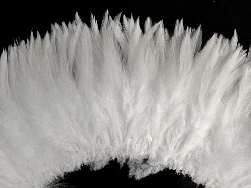 Soft white fluffy feathers for DIY crafts and fashion accessories.