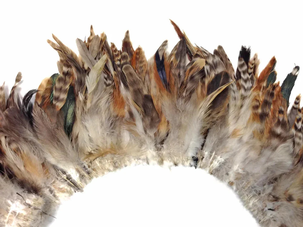 Natural brown and tan patterned feathers for DIY crafts and fashion accessories.
