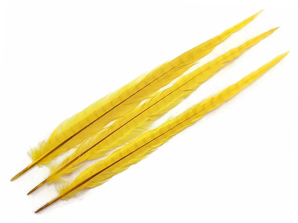 Three vibrant yellow feathers for crafts and fashion DIY supplies on a white background.