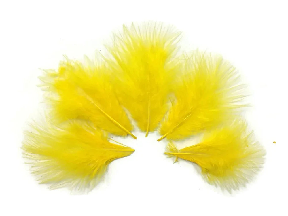 Vibrant bright yellow feathers arranged in a fan shape for craft and fashion DIY supplies.