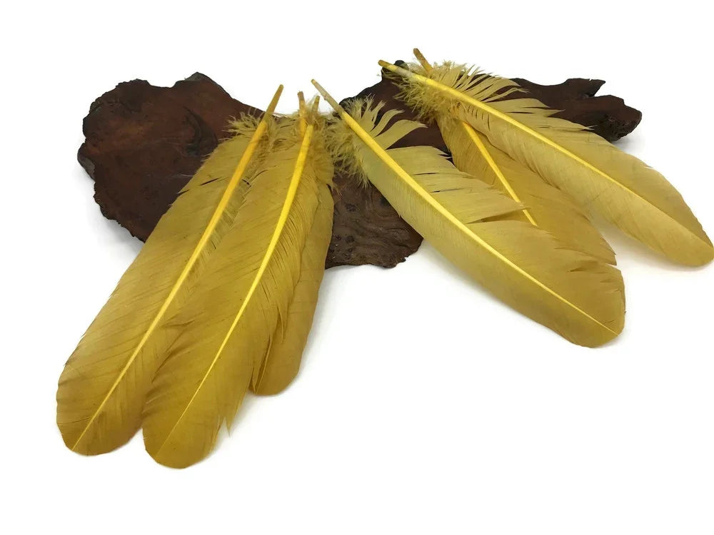 Vibrant yellow craft feathers arranged on a dark wooden base for DIY fashion and decor.