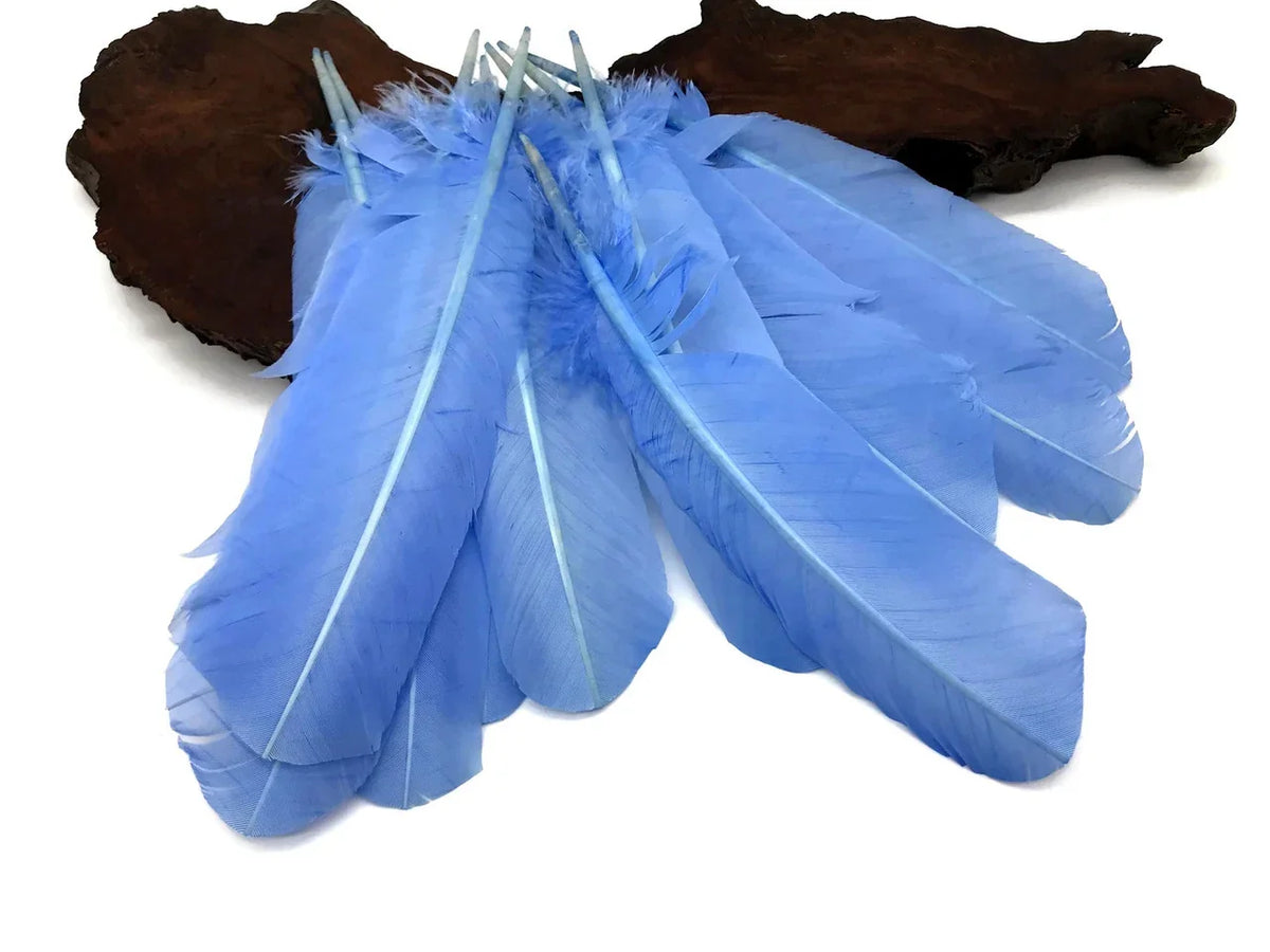 Vibrant light blue craft feathers for DIY fashion and décor projects.